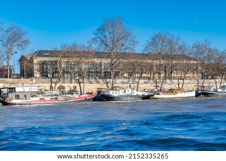 Paris, houseboats on the Seine, with the Orangerie in background Royalty-Free Stock Photo #2152335265