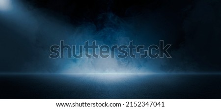 The dark stage shows, dark blue  background, an empty dark scene, neon light, spotlights The asphalt floor and studio room with smoke float up the interior texture for display products Royalty-Free Stock Photo #2152347041
