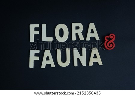 Word 'Flora and fauna' on black 
background. Flora and fauna means “plants and animals.” Flora referring to plants, and fauna refers to animals. Royalty-Free Stock Photo #2152350435
