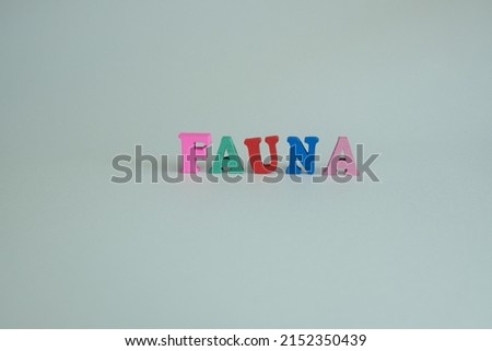 Word 'Fauna' on white background. Fauna is a term which refers to all of the animal life within a specified region, time period, or both. Royalty-Free Stock Photo #2152350439