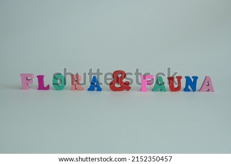Word 'Flora and fauna' on white background. Flora and fauna means “plants and animals.” Flora referring to plants, and fauna refers to animals. Royalty-Free Stock Photo #2152350457