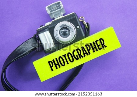 camera models for photographing and colored paper with the words of the photographer
