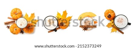 Set of cups with tasty pumpkin latte on white background, top view