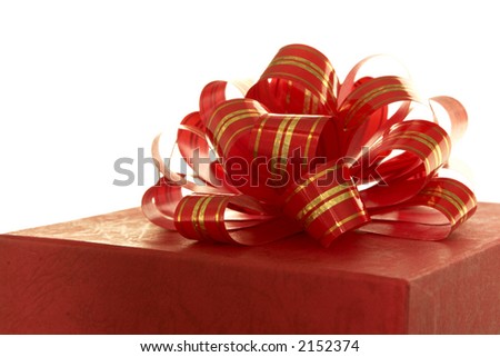 red ribbon and gift box over white background