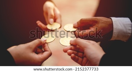 Close-up photo of Bitcoin, business people holding coins together Cryptocurrency Market Trends Bitcoin Stock Growth Investing in Virtual Assets investment platform Investing in today's world 