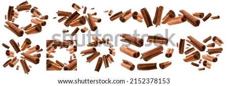 A set of photos. Cinnamon sticks levitate on a white background Royalty-Free Stock Photo #2152378153
