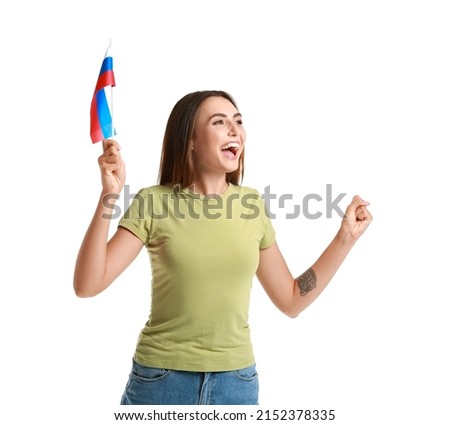 Happy young woman with national flag of Russia on white background