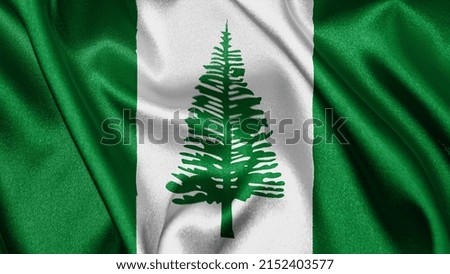 Close up realistic texture fabric textile silk satin flag of Norfolk Island waving fluttering background. National symbol of the country. 8th of June, Happy Day concept