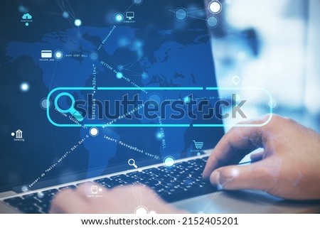 Close up of hand using laptop with creative search bar and digital blue map icons on blurry background. Address and Url concept. Double exposure