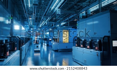 Wide Shot Inside Advanced Semiconductor Production Fab Cleanroom with Working AGV robots. Royalty-Free Stock Photo #2152408843