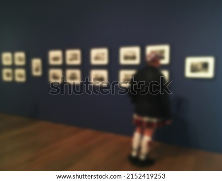 People in art gallery, white background; blurred 100%