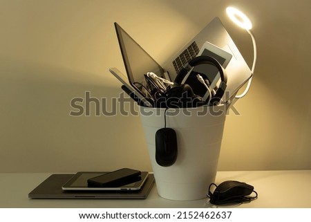 Planned obsolescence, e-waste, electronics waste for reuse and recycle concept. Recycling bin full of old electronic devices Royalty-Free Stock Photo #2152462637