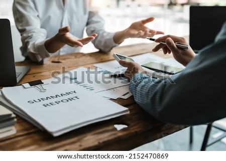 Businessman bookkeeper holding calculator for calculate financial data at meeting room, Business Financing Accounting Banking Concept