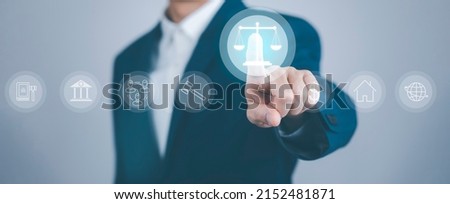 Businessman Hand touch the graph labor law attorney legal business concept internet technology,Planning buy Real Estate, Planning to buy property and Choose the best, financial liabilities concept Royalty-Free Stock Photo #2152481871