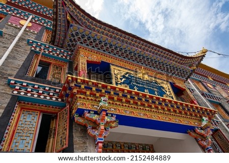 Facade of the Jingang Tibetan buddhism Temple in Kangding, Garze Tibetan Autonomous Prefecture, Sichuan, China. Capture in Chinese and Tibetan, translation: "Jingang Tibetan Temple"