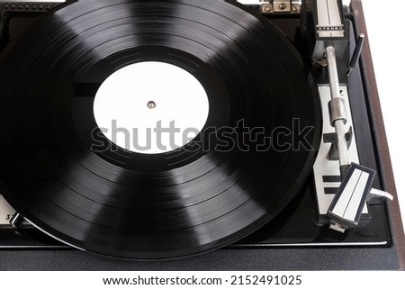 Close up of turntable needle on a vinyl record. Turntable playing vinyl. Needle on rotating black vinyl. Royalty-Free Stock Photo #2152491025