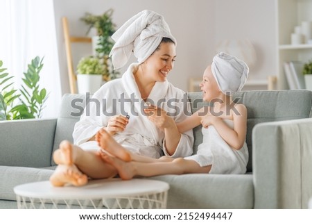 Happy family. Mother and daughter child girl are having fun after a bath.