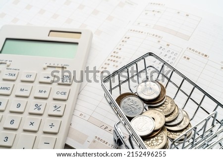 Household accounts book and saving money. Calculating personal finance. Royalty-Free Stock Photo #2152496255
