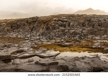 Volcanic landscape. Cooled lava is black rocky texture