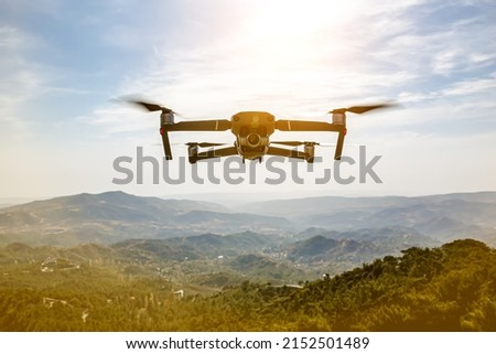 A drone flying over nature and making beautiful pictures and videos