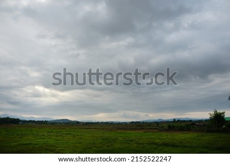 Nimbostratus clouds are dark, grey, featureless layers of cloud, thick enough to block out the Sun. Producing persistent rain. Royalty-Free Stock Photo #2152522247