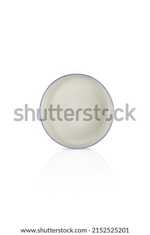 Handmade ceramic plate isolated on white background.