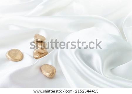 Stacked golden Zen stones product photography background, stand or podium pedestal , luxury advertising display 