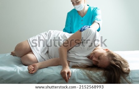 Doctor process epidural nerve block for pregnant woman Royalty-Free Stock Photo #2152568993