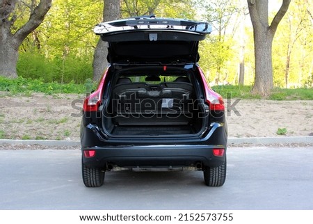Modern car SUV with open empty trunk. Modern wagon car open trunk. Car boot is open. Royalty-Free Stock Photo #2152573755