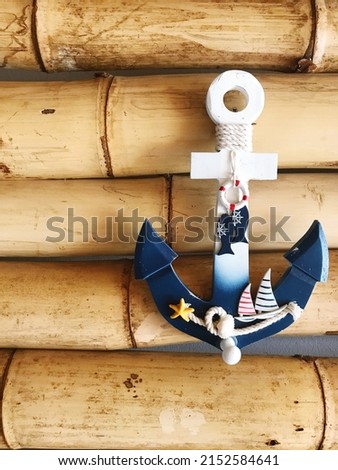 Commemorative gift anchor symbol on a wooden wall