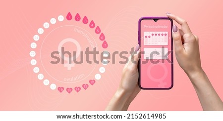 Menstrual cycle tracker mobile app on smartphone screen in hands of woman, graphic representation of period calendar on pink background. Modern technologies for women's health, pregnancy planning Royalty-Free Stock Photo #2152614985