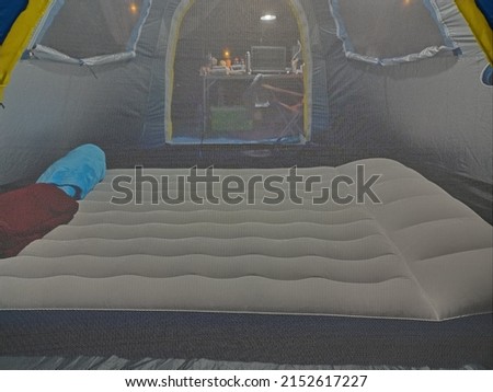 camping mattress,white in tent,Take a photo through a mosquito net