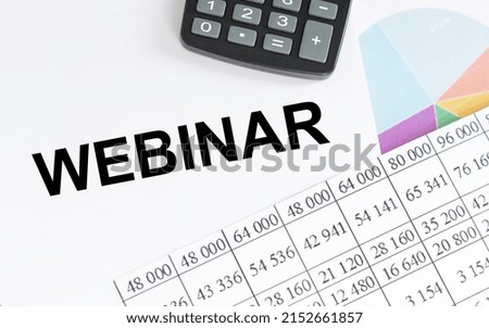 WEBINAR text on a notepad on a desk among reports, a business concept