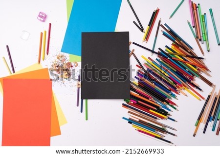 drawing workstation with colored pencils and paper