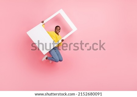 Full length photo of young pretty girl have fun jump shooting picture isolated over pink color background