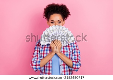 Photo of hooray brunette lady hold money wear plaid shirt isolated on pink color background