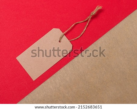 Blank craft vintage price tag isolated on red background. Sale, discount concept.