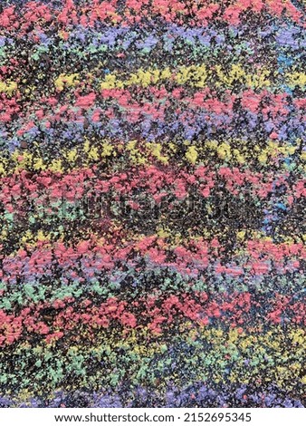 Photograph of a colorful chalk drawing on a gravel ground makes for a great texture. This can be used as a background or on its own. Endless uses. 