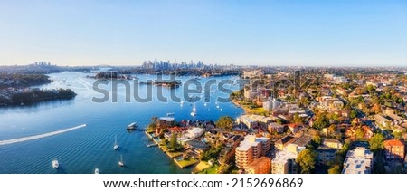 Drummoyne inner city suburb on Parramatta river in Sydney West - aerial panorama towards CBD cityscape. Royalty-Free Stock Photo #2152696869