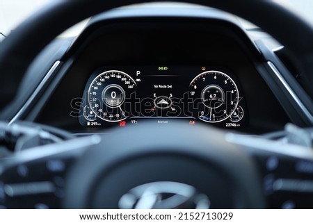 A closeup of a car dashboard with speedometer, odometer, and compass Royalty-Free Stock Photo #2152713029
