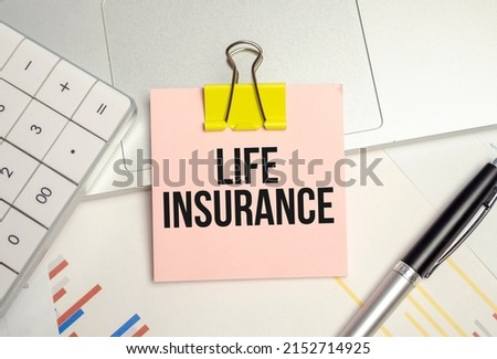life Insurance word on tag label with calculator, Royalty-Free Stock Photo #2152714925