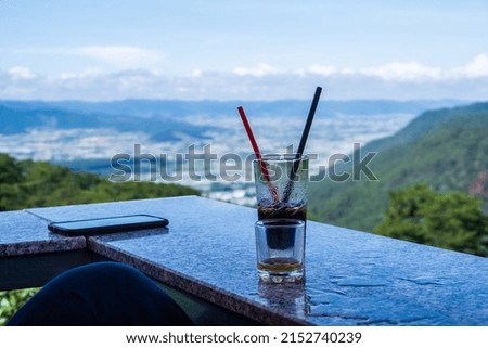 Sitting and enjoying the scenery, drinking coffee at Cau Dat, Da Lat