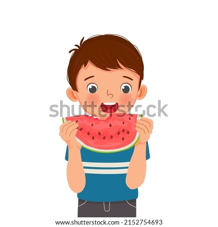 Cute little boy eating watermelon on sunny day in summertime