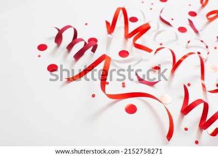 birthday background with red serpentine on white Royalty-Free Stock Photo #2152758271