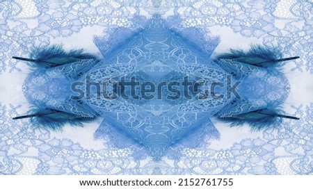 lace fabric. bird feather. blue color on a white background. Delicately crafted from yarn or thread, lace fabrics have historically embodied class and beauty since their inception in the 16th century.
