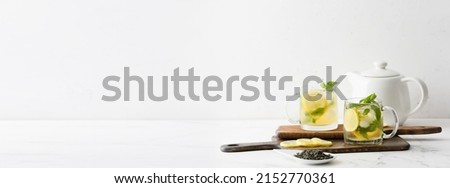 Cups of tasty iced green tea on white background with space for text Royalty-Free Stock Photo #2152770361