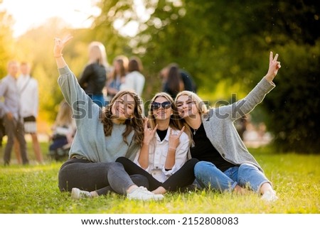 Shared photos of teenagers or high school students. Holidays in schools. Summer photos of schoolchildren or students. Girls and boys are cheerful and happy in the photo. All brands are hidden.