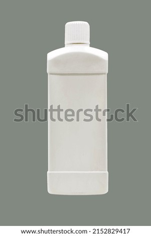 Square white plastic bottle with front. on a green background