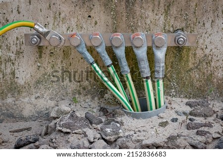 Picture of electrical grounding in a industrial area, it prevents hazard in electrical shortcut situations Royalty-Free Stock Photo #2152836683