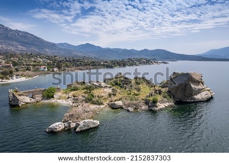 Lake Bafa is a lake and a nature reserve situated in southwestern. At the innermost north-east tip of the lake is the village of Kapikiri, as well as the ruins of Heraclea by Latmus.